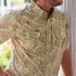 The Pearsall short sleeve shirt in a soft beige and green botanical pattern
