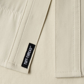 Tuff Threads tag at bottom of shirt