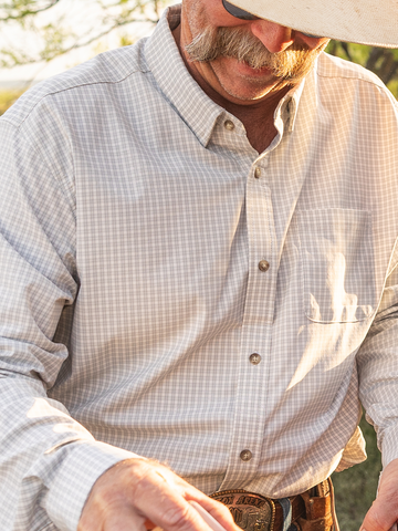 Man in white and gray plaid shirt