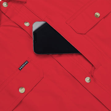 closeup of phone going into chest pocket