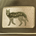 Embroidered patch of a standing wolf with the word "PONCHO" stitched on its body in green and beige tones.