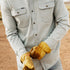 Poncho Outdoors The Judd light gray men's outdoor shirt with button pockets worn with work gloves outdoors