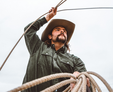 Man in black shirt roping