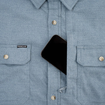 Phone in chest pocket of blue flannel