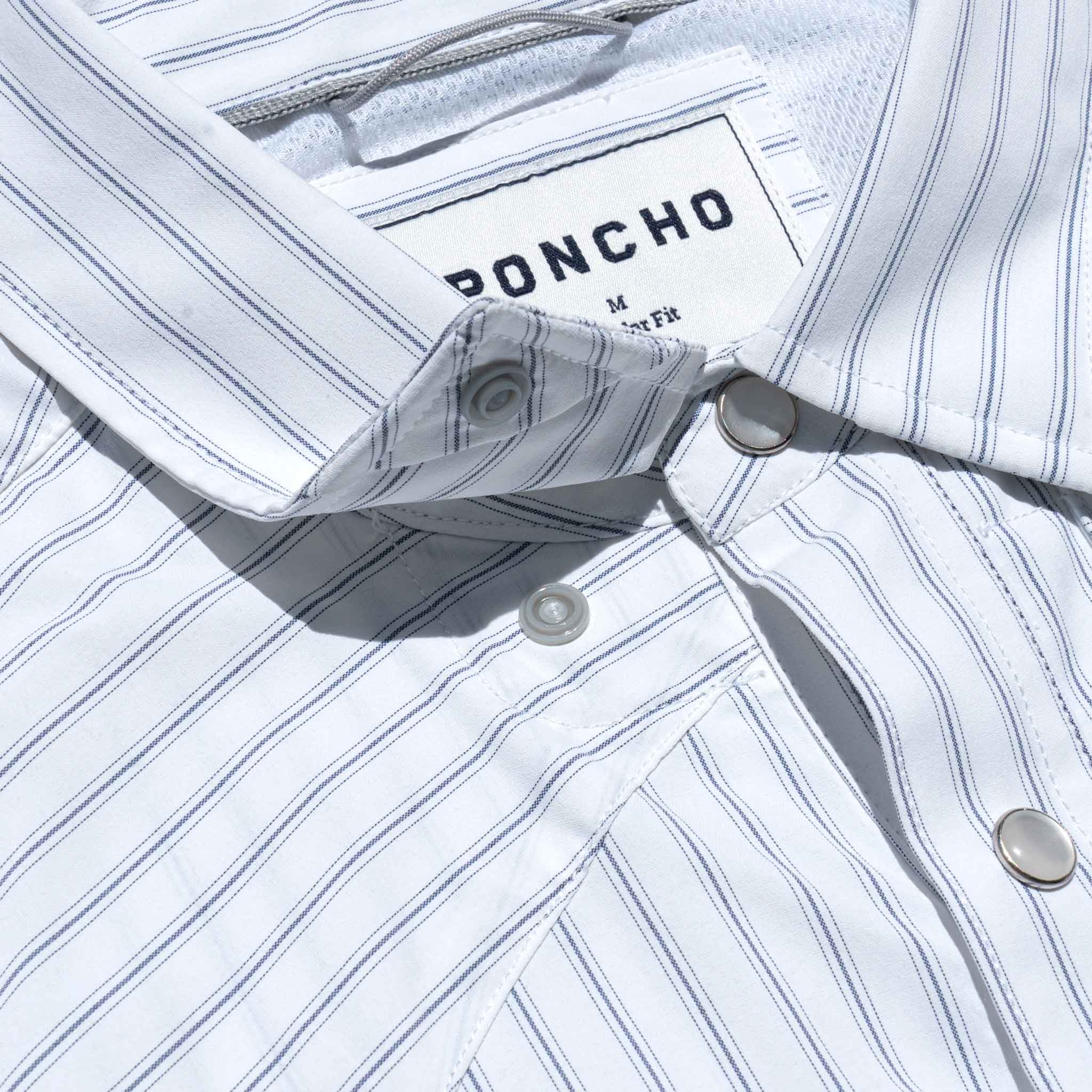 close up photo of collar snaps on striped western shirt