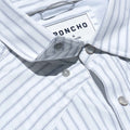 close up photo of collar snaps on striped western shirt