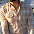 guy wearing shirt on boat, sun on shirt