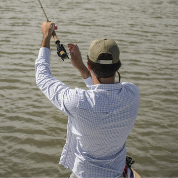 Plaid western long sleeve man fishing
