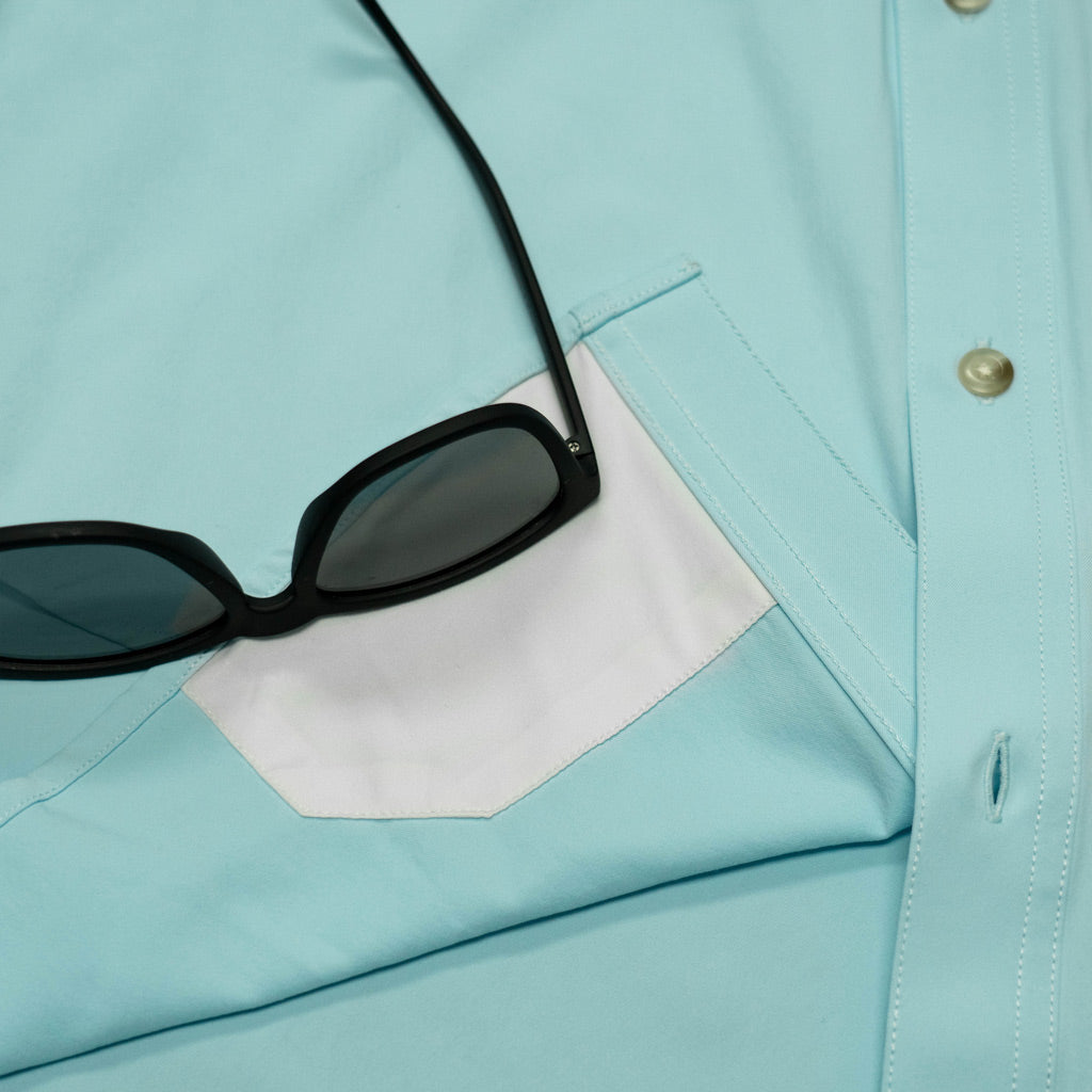 Aqua green shirt long sleeve lens cleaner close up