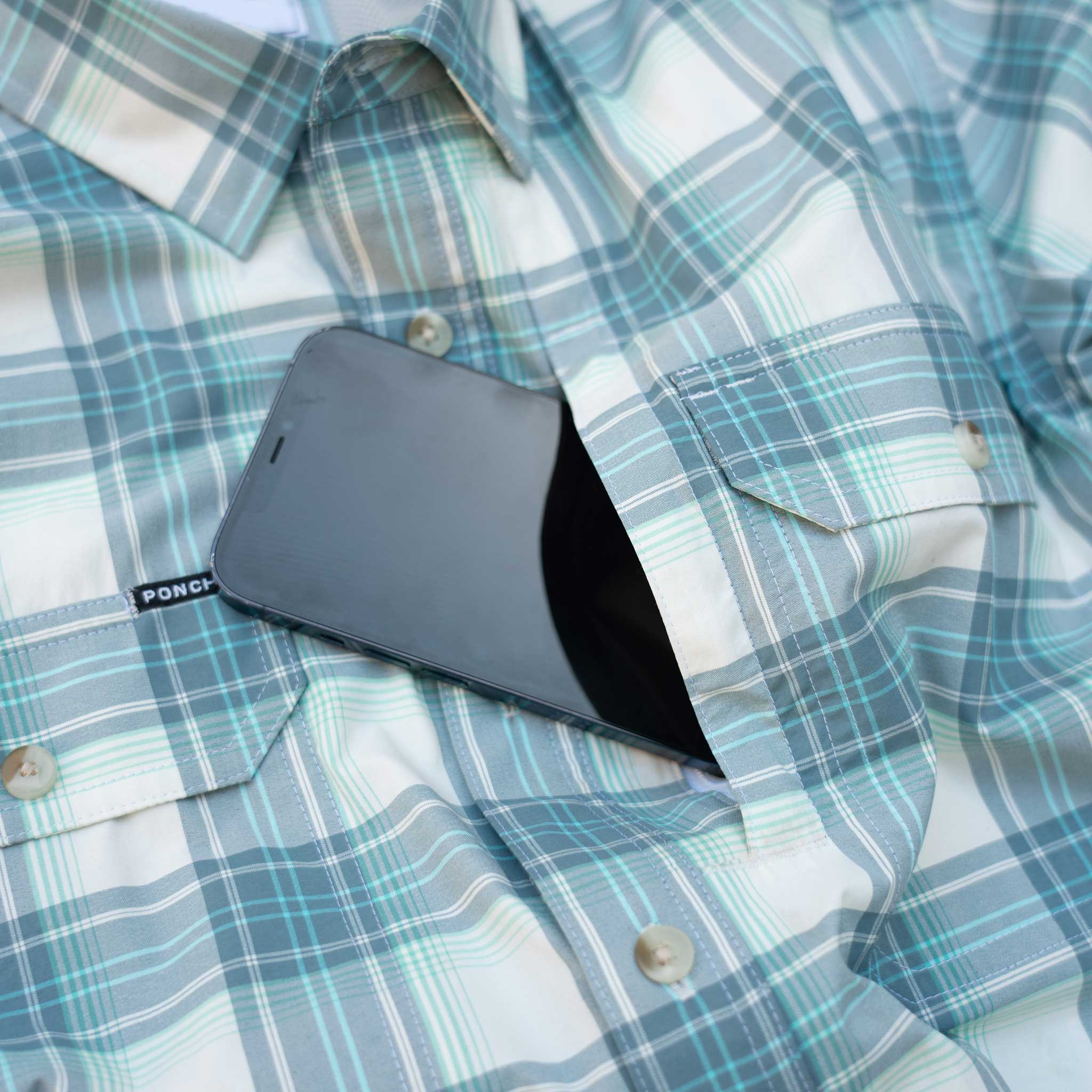 close up of phone in chest zip pocket