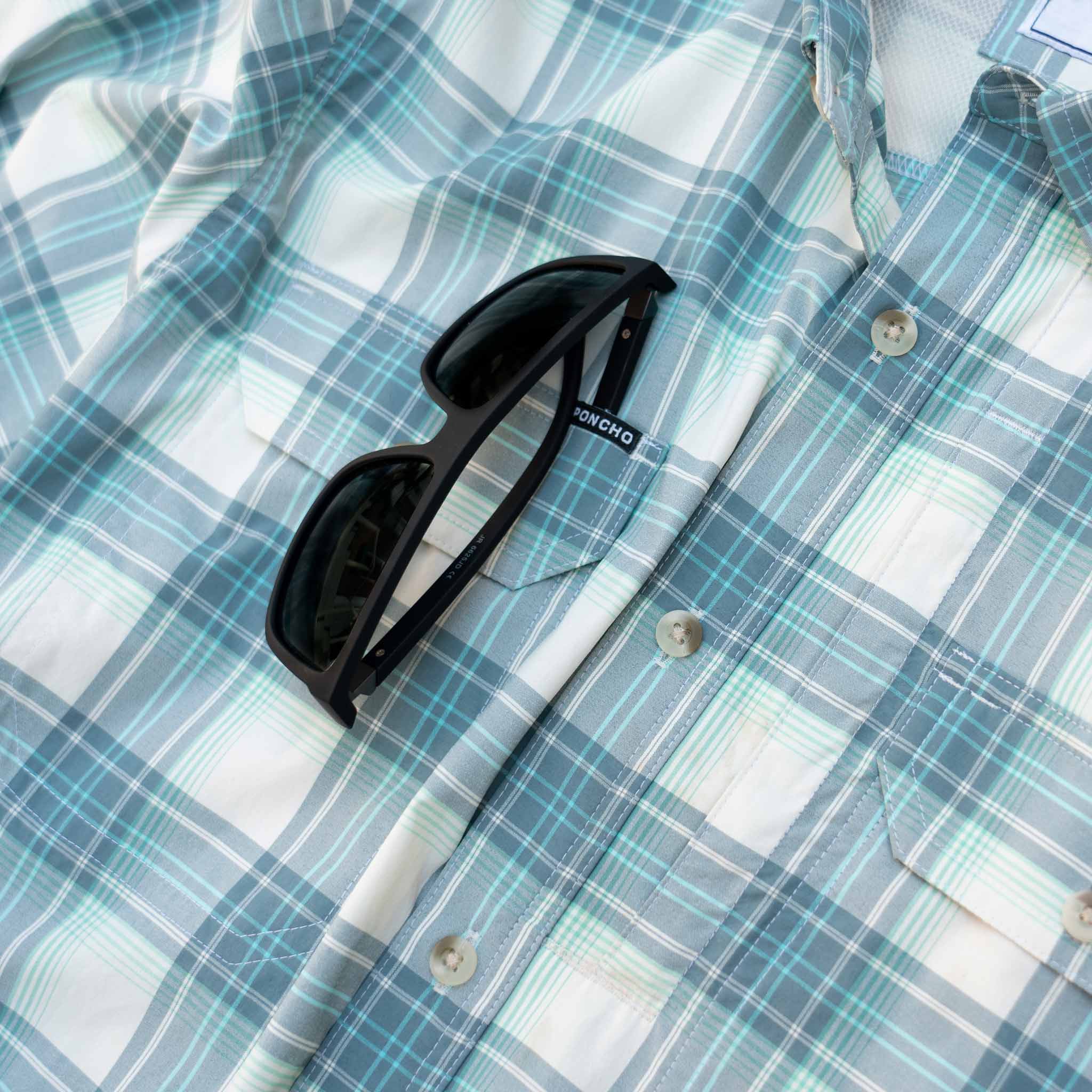 closeup of sunglasses on shirt