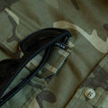 Close up of camo shirt with sunglasses
