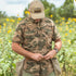 Man wearing light camo short sleeve shirt in field