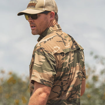 Man wearing short sleeve camo shirt