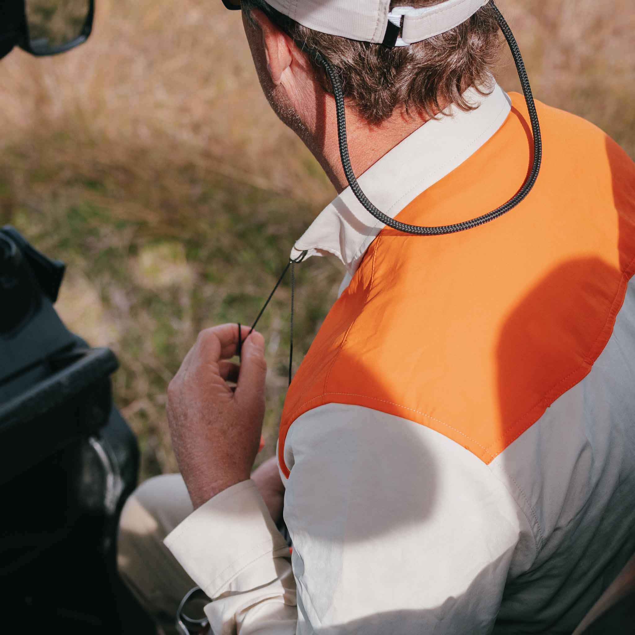 view of long sleeve tan shirt with blaze patch from behind