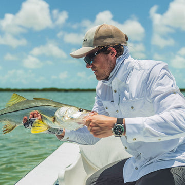 Man in white shirt with fish