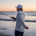 Man fishing in white hat