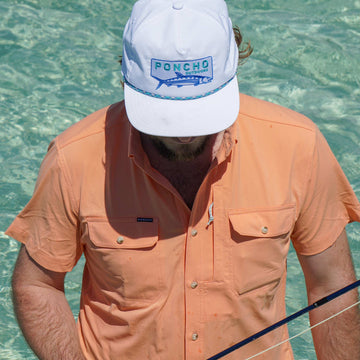 man wearing short sleeve light orange shirt