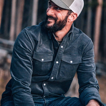 guy wearing navy corduroy lifestyle shirt in woods