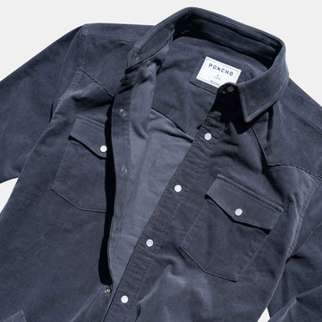 closeup of texture of navy corduroy pearl snap shirt