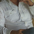 man wearing white long sleeve pearl snap shirt