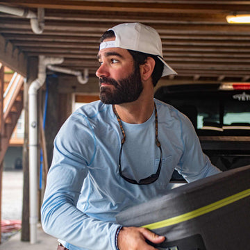 lifestyle pic of guy wearing pelican hat showing snapback closure