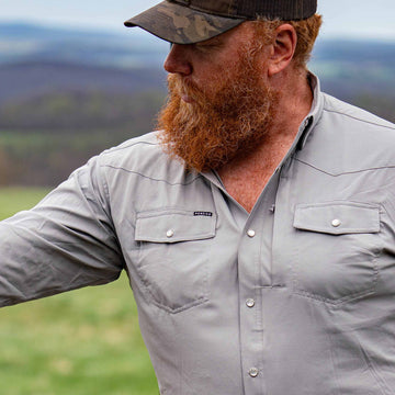 man wearing pearl snap shirt