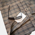 closeup of lens cloth on flannel shirt