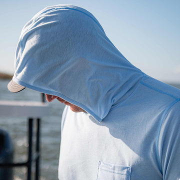 man wearing sky blue hoodie
