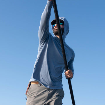 man wearing slate blue hoodie