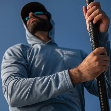 man wearing slate blue hoodie