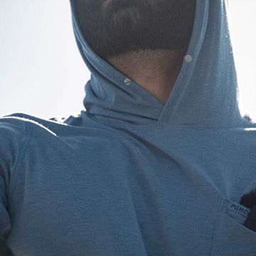 man wearing slate blue hoodie