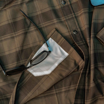 closeup of lens cloth on flannel shirt