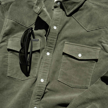 closeup of sunglasses slit on corduroy shirt