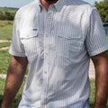 Close up of man wearing short sleeve striped shirt