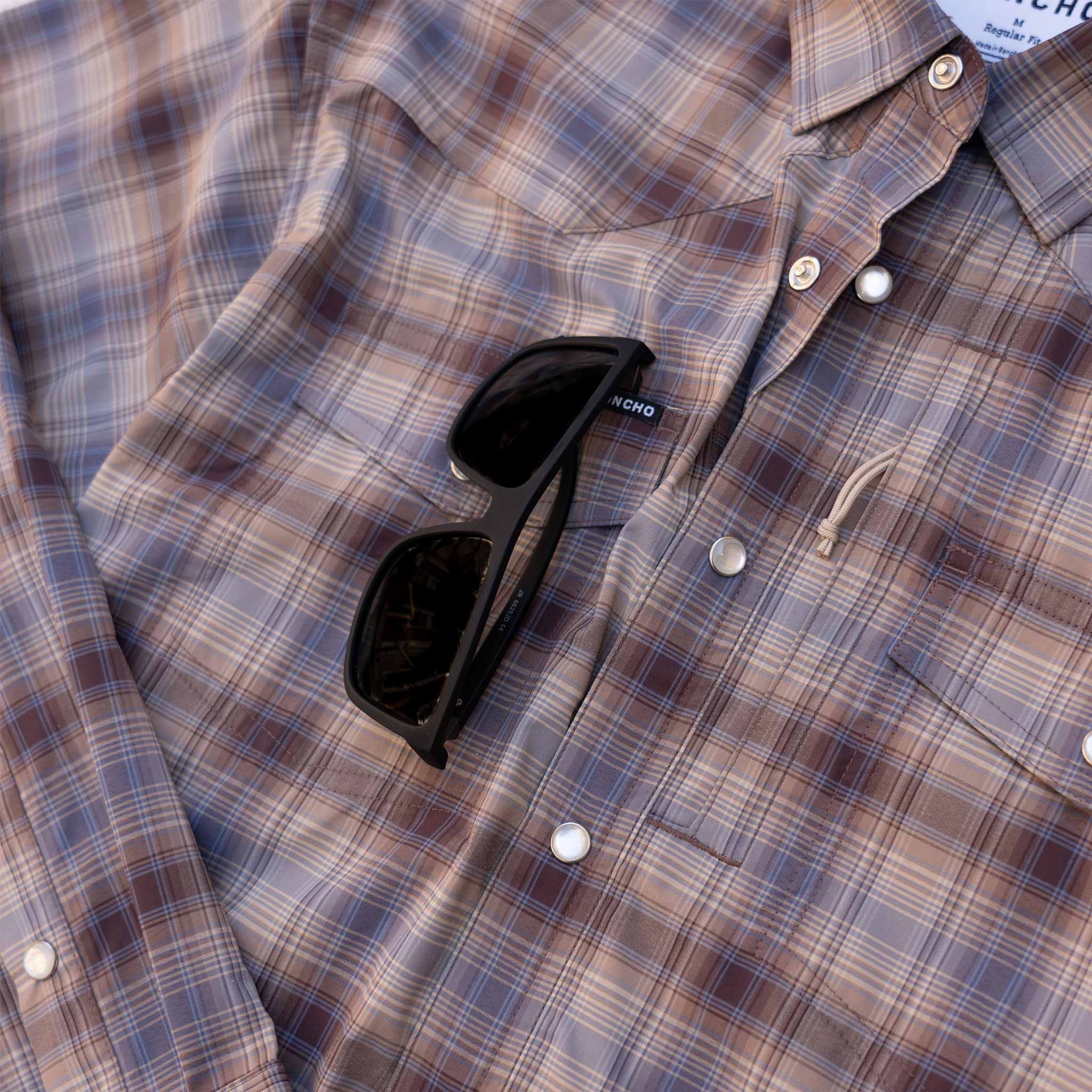 close up of sunglasses on shirt