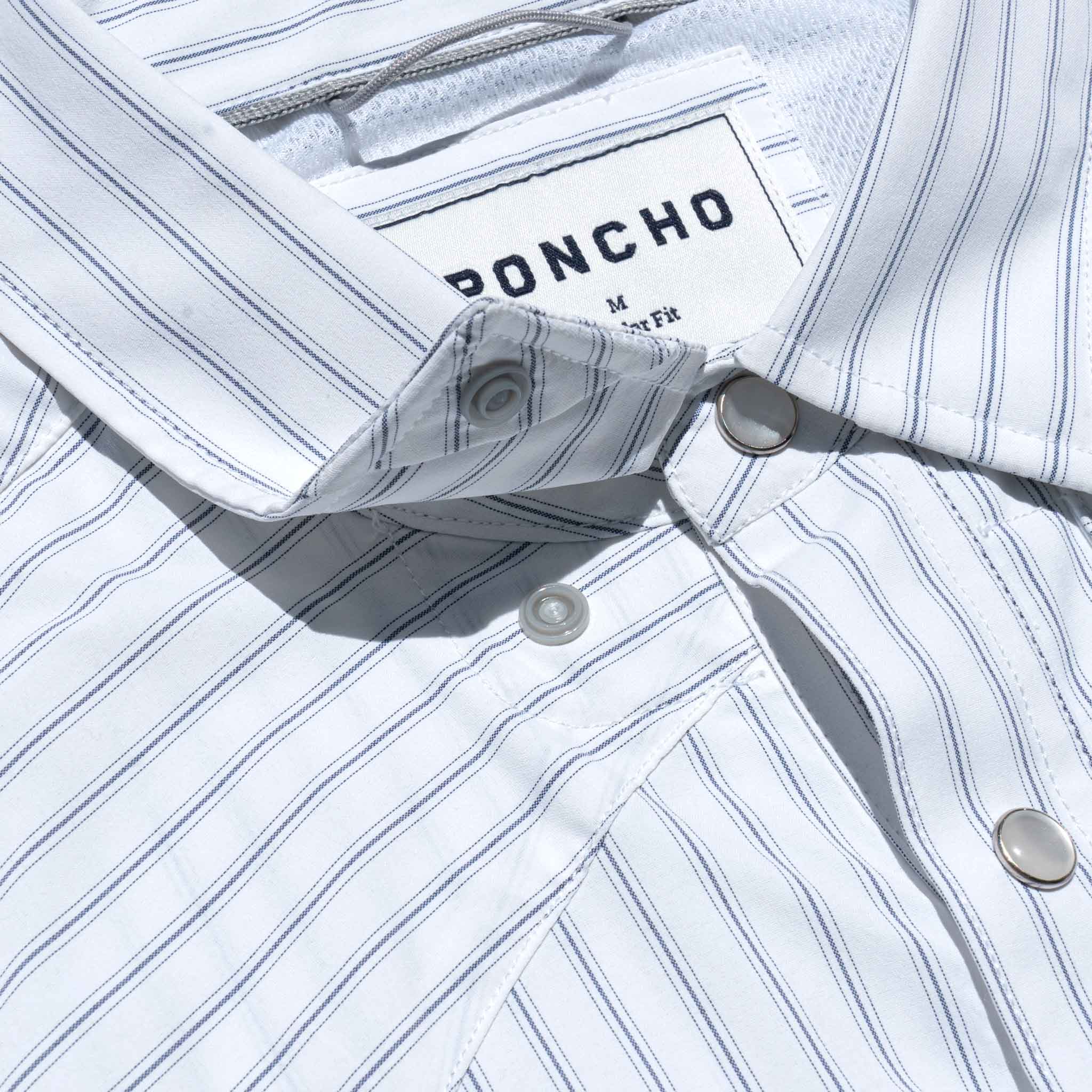Close up of collar snaps on a striped shirt