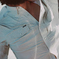 closeup of chest of man wearing shirt