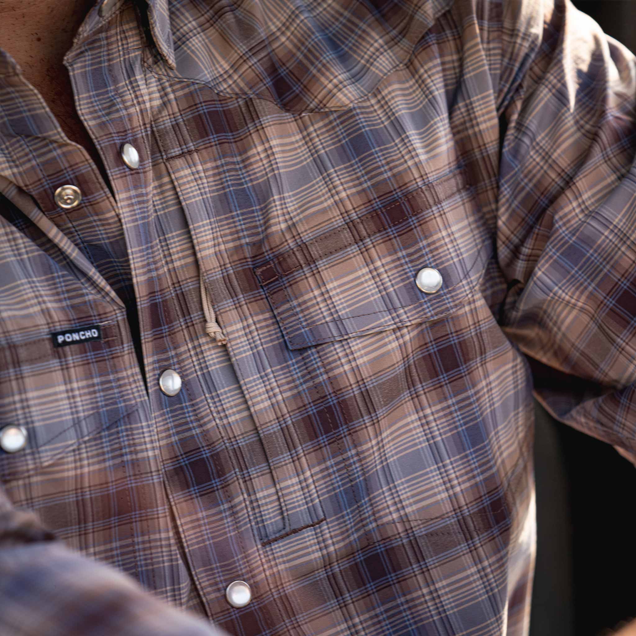 closeup of brown blue plaid shirt