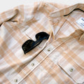 closeup of sunglasses slit on shirt pocket