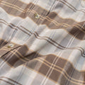 close up of brown and grey plaid long sleeve flannel