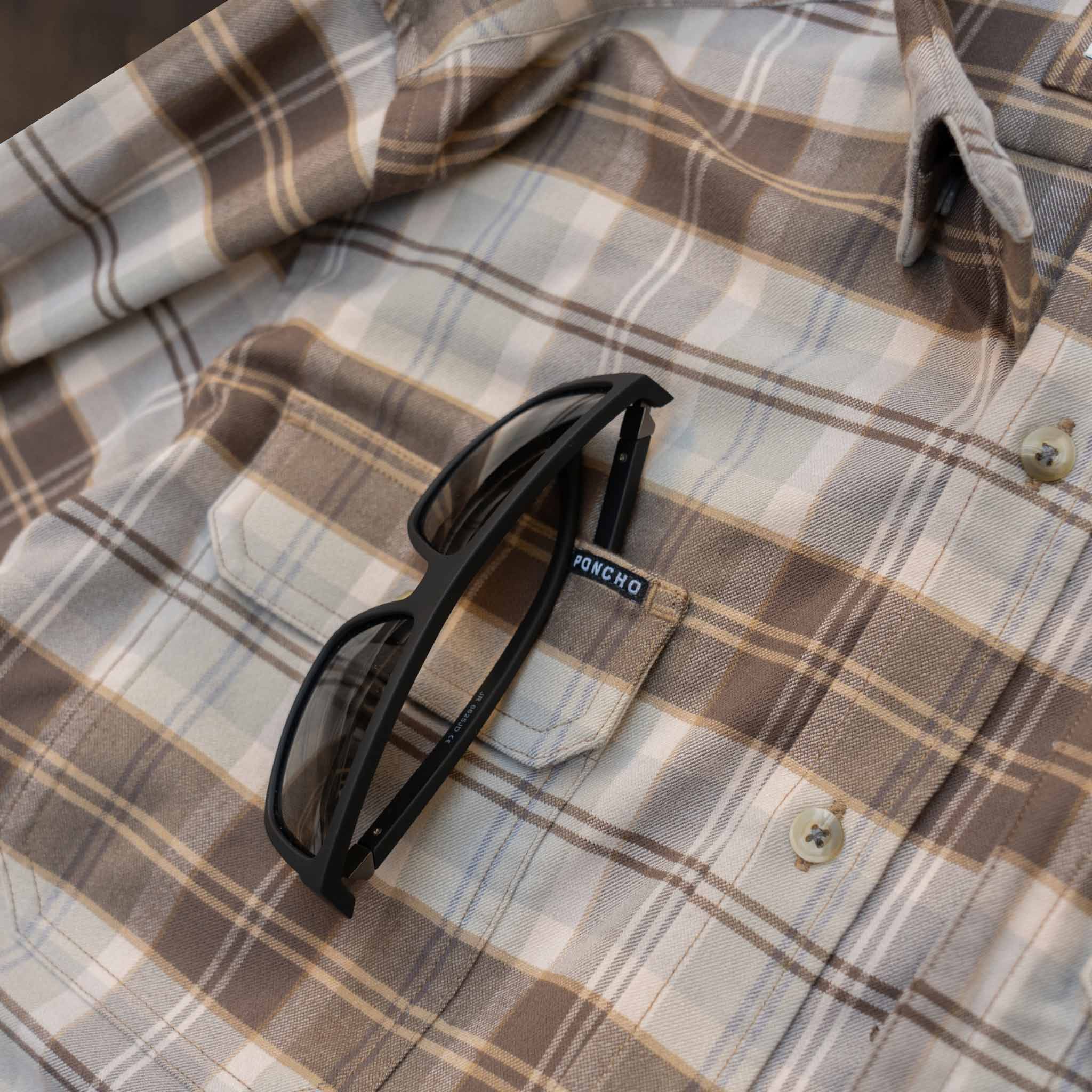 close up of right chest pocket with sunglasses tucked in