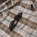 close up of right chest pocket with sunglasses tucked in