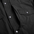 closeup of black long sleeve pearl snap shirt 