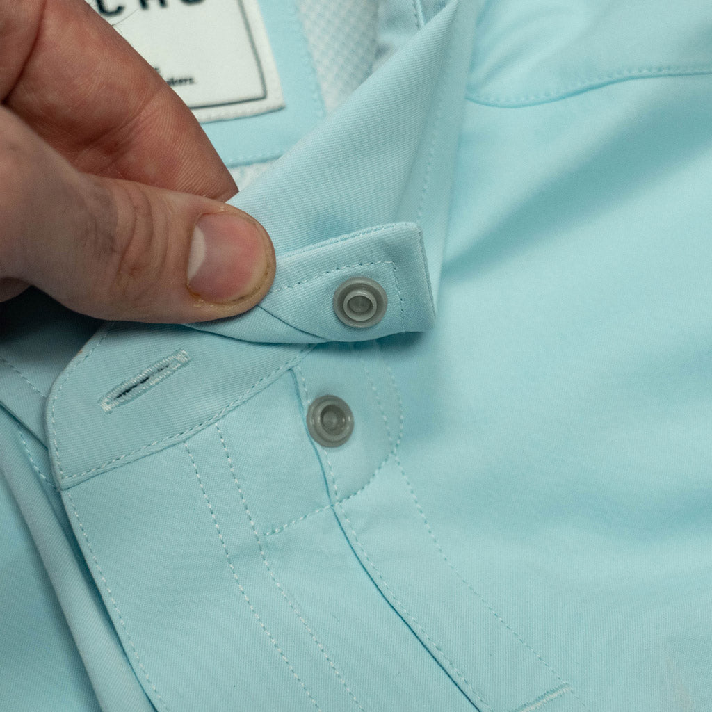 Aqua green shirt short sleeve collar snap close up