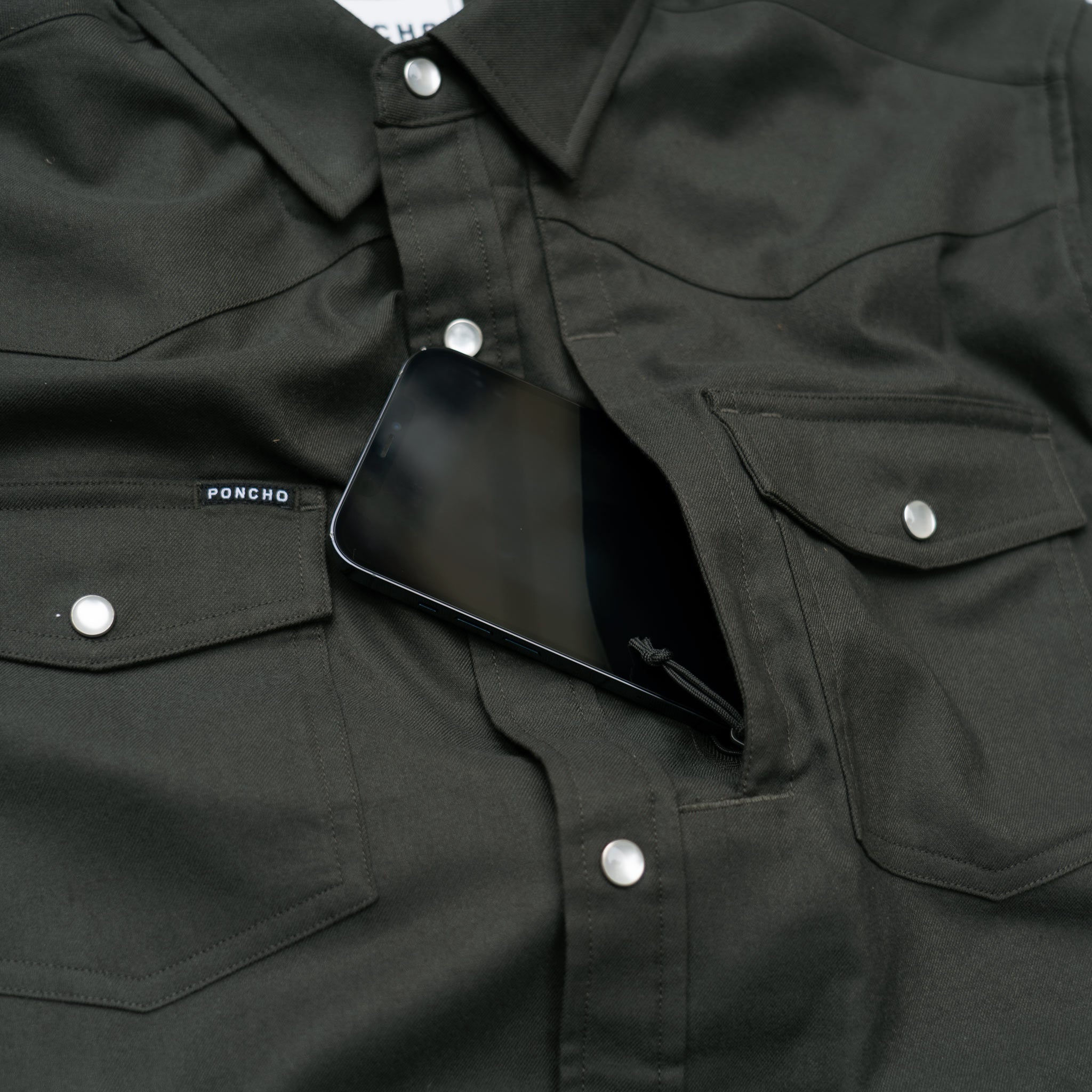 phone in chest pocket in shirt