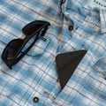 Close up photo of Blue Bison shirt, shows pocket with cell phone and sunglass holder.
