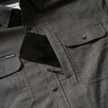 Close up of cell phone pocket of shirt 