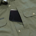 close up of phone entering front chest pocket