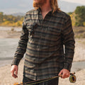 Man with fishing rod wearing the Kodiak plaid flannel